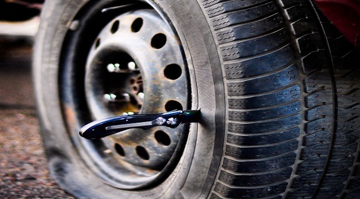bigstock-knife-in-tire-10979330