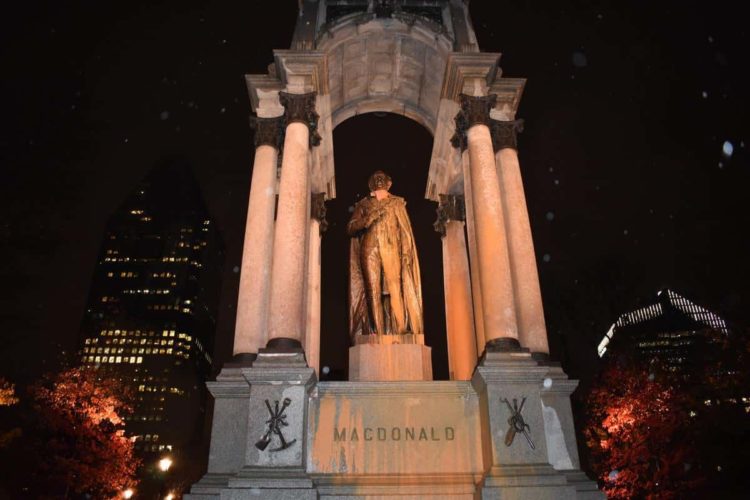 Anti-colonial zombies attack John A. Macdonald Monument with orange paint