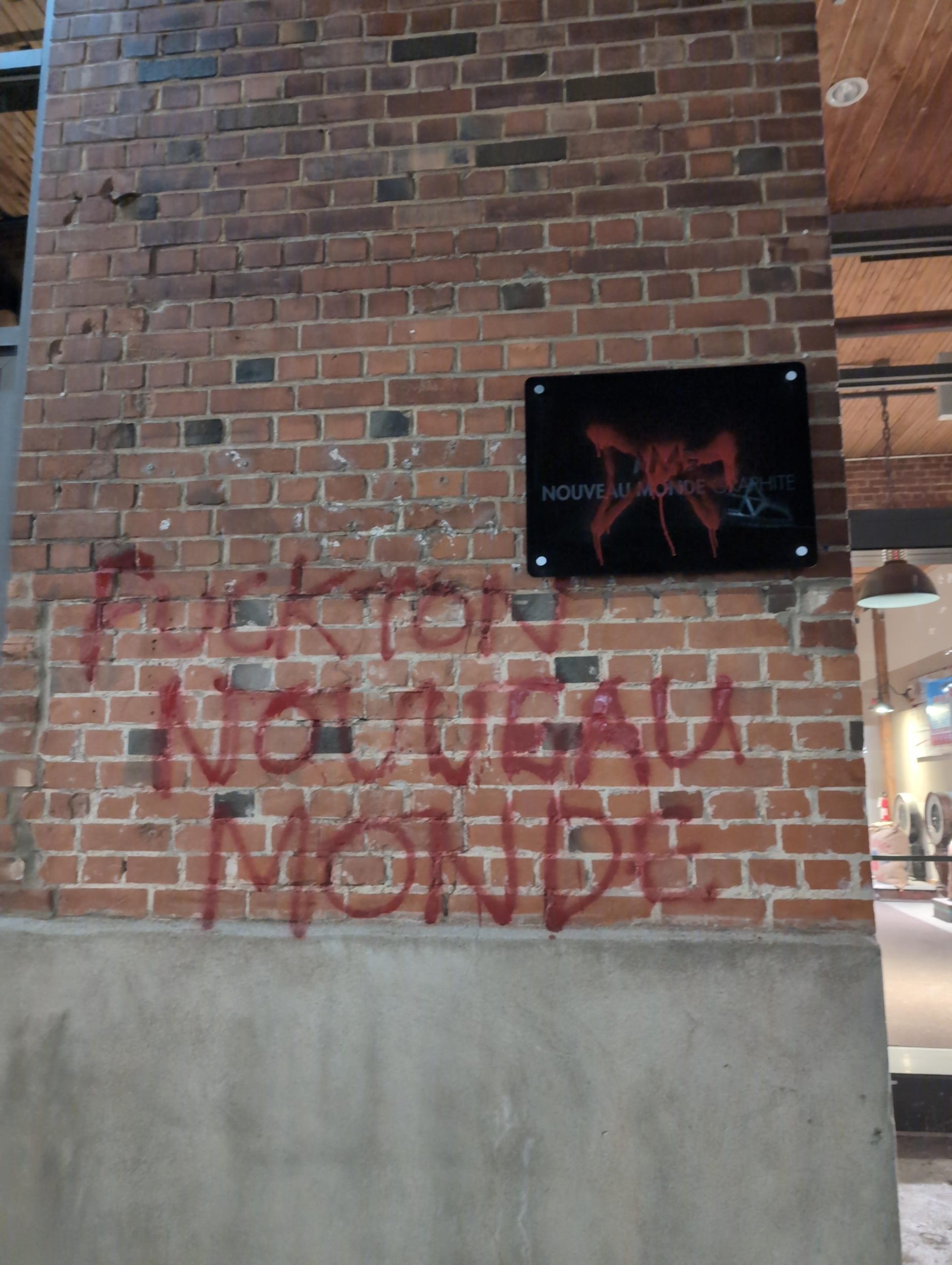 “FUCK TON NOUVEAU MONDE”: Vandalism at Nouveau Monde Graphite’s Downtown Montreal Offices